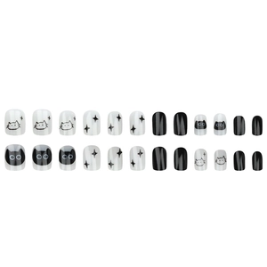 Flat lay of cat and star pattern press-on nails in black and white minimalist design