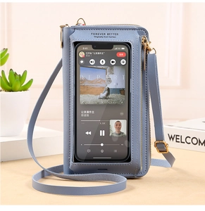 Detail of blue crossbody phone bag with a transparent touch window for direct screen access