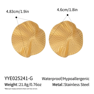 Detail view of gold stainless steel ruffled earrings with textured finish and measurements