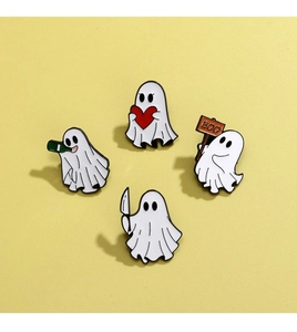 Detail of four cute Halloween ghost enamel pins with heart and BOO signs on yellow background