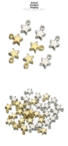 Close-up of gold and silver five-point star pendants for DIY jewelry crafting