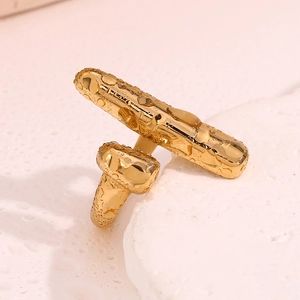 Macro shot of 18K gold plated cylindrical ring with textured water droplet design