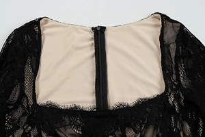 Detailed view of black eyelash lace dress featuring a square neck and invisible back zipper