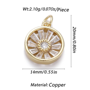 Golden sunburst pendant with clear gemstones and copper base on a white background