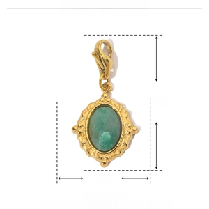 Detail view of 28mm gold stainless steel oval pendant with green natural stone