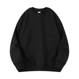 Classic black crewneck sweatshirt in loose fit featuring ribbed cuffs and hem details
