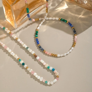 Detail shot of 18K gold-plated necklace with colorful natural stones and freshwater pearls