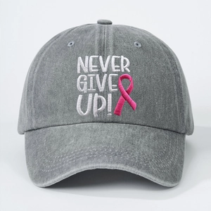 Grey washed cotton baseball cap with embroidered Never Give Up text and pink ribbon icon