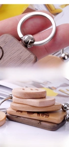 Macro detail of hand-polished wooden zodiac keychain with custom engraved letters