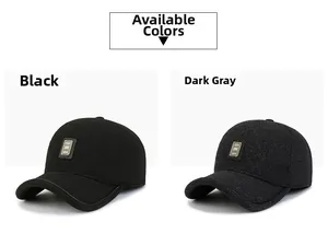 Detail of wool texture and embossed metal plate on black and dark gray baseball caps