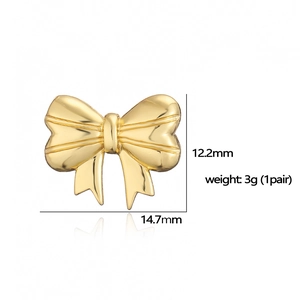 Detail showing 18K gold butterfly bow earrings with size 12.2mm by 14.7mm and 3g weight