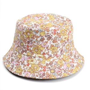 Detailed close-up showing the soft floral pattern and high-quality cotton fabric of the sun hat