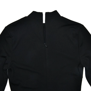 Close-up of invisible zipper closure and stand collar on black slim fit dress back