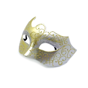 Detail of masquerade half-mask with gold and silver gradient and glitter scroll patterns