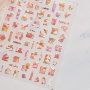 Close-up of geometric iridescent shell-light nail stickers with gradient pearlescent effect
