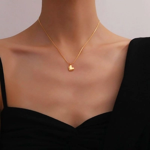 Elegant gold heart pendant necklace for women with a minimalist thin steel chain