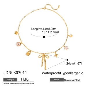 Detail view of 18K gold stainless steel necklace with bow and flower charms specs