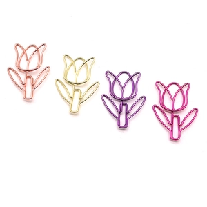 Detailed close-up of tulip-shaped metal paperclips in gold, rose gold, purple, and magenta