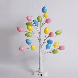 Detailed view of LED birch tree base with control switch and colorful Easter egg ornaments