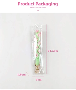 Detailed packaging showing a 21.5cm handmade woven lanyard with pink floral accents