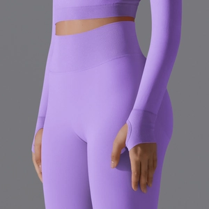 Detail of lilac seamless ribbed workout set featuring thumbhole cuffs and high waist legging