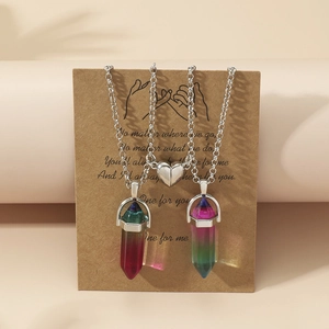 Detail of magnetic heart clasp connecting two hexagonal crystal stone couple necklaces