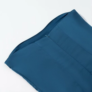 Detail of dark blue satin dress showing invisible zipper and premium stitching