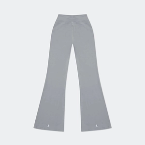 Detailed close-up of symmetrical white X logo on grey high-waisted flared yoga pants