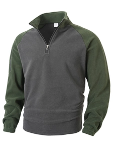 Detail of army green and charcoal fleece pullover featuring half-zip collar and color block
