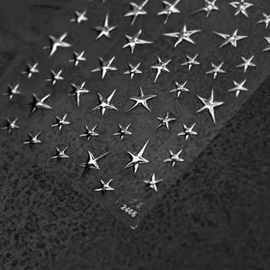 Macro detail of Meteor silver embossed star nail art stickers with metallic finish