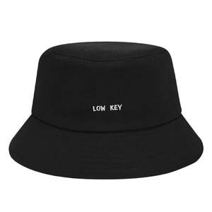 Minimalist black cotton bucket hat with white LOW KEY letter embroidery and reinforced brim