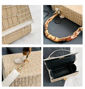 Detail shots of beige croc-embossed leather bag with bamboo handle and gold hardware
