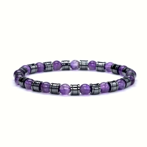 Handmade beaded bracelet with purple amethyst stones and metallic spacers on white background