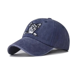 Washed navy denim baseball cap with Chihuahua dog face embroidery at a 45-degree angle