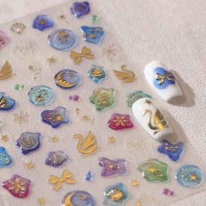 3D gold embossed nail stickers with swan and bow designs on gradient base for nail art