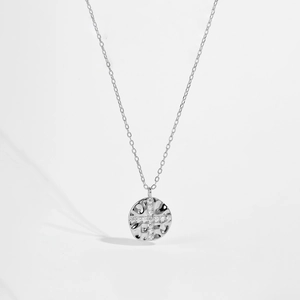Detailed close-up of s925 silver necklace featuring a hammered texture coin and zircon cross