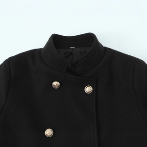 Women's short double-breasted black coat featuring ornate embossed golden metal buttons