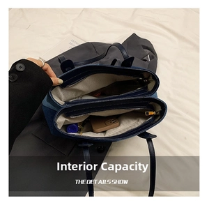 Detail showing the large capacity with multi-compartment interior for the denim tote bag