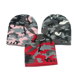 Winter camouflage knit beanies in pink, red, and white patterns for outdoor warmth