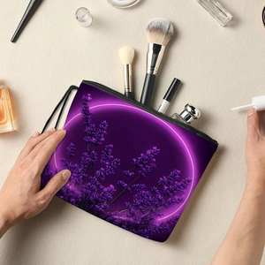 Purple lavender floral toiletry bag with zipper being held over makeup accessories