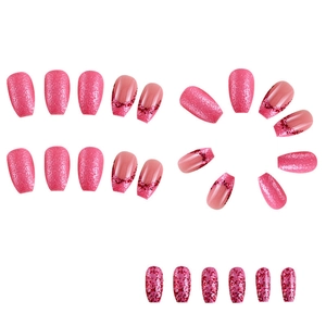 Detail of pink glitter French press-on nails with various sizes on a white background