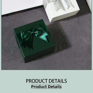 Detailed view of square dark green jewelry gift box with elegant satin ribbon bow