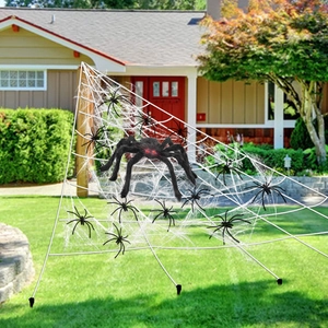 Giant white triangular spider web with large black red-eyed spider for Halloween decor