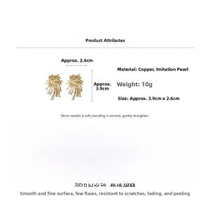 Detail view of fireworks star pearl earrings in gold finish with precise 3.9cm size measurements