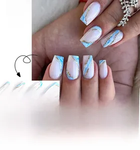 Detail of white and blue marble ballerina fake nails with gold glitter accents