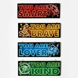 Neon game wall decor set featuring game controllers and inspiring quotes for teen rooms