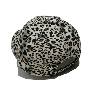 Detail view of leopard print baseball cap featuring six-panel construction and rear adjustment