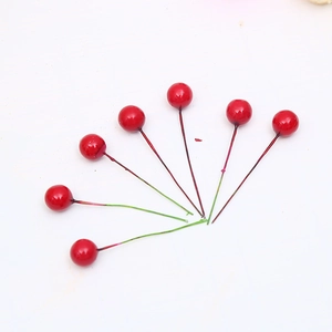 Fan-shaped arrangement of seven red artificial berry stems for DIY Christmas floral decor