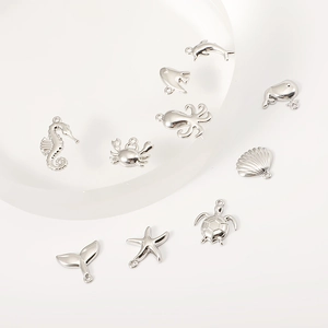 Silver stainless steel ocean themed charms featuring seahorse starfish and turtle pendants