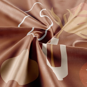 Detail of terracotta silk satin tapestry with white abstract floral prints and textures